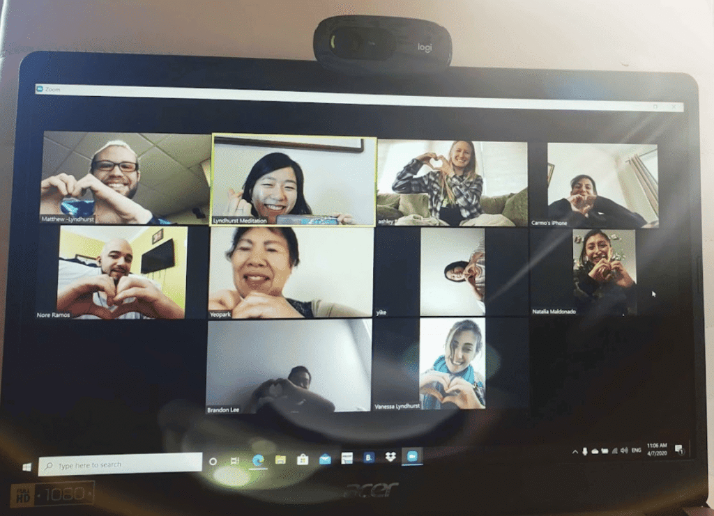 Participants practicing meditation together in an online Zoom class
